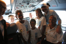 <center>85 marmailles de 1000 Sourires <br> touchent le ciel avec XL Airways                                                                    