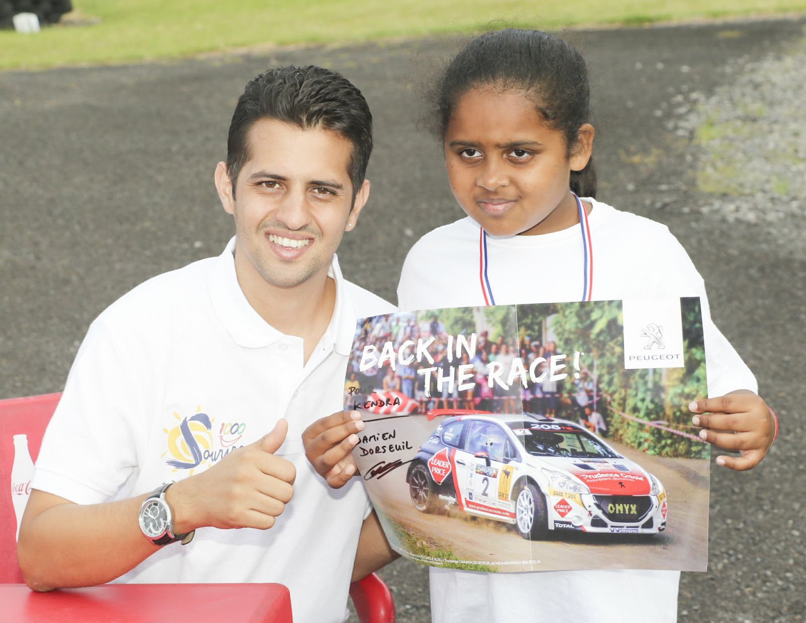 <center>Les  marmailles de 1000 Sourires à 100 à l’heure <br>avec les champions au Circuit  Félix Guichard